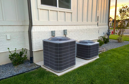 AC installation at Powells. New air conditioner units outside.